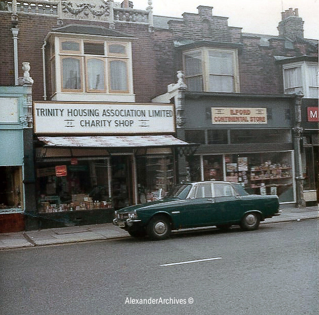 Trinity Housing Association charity shop in London with a green car parked outside